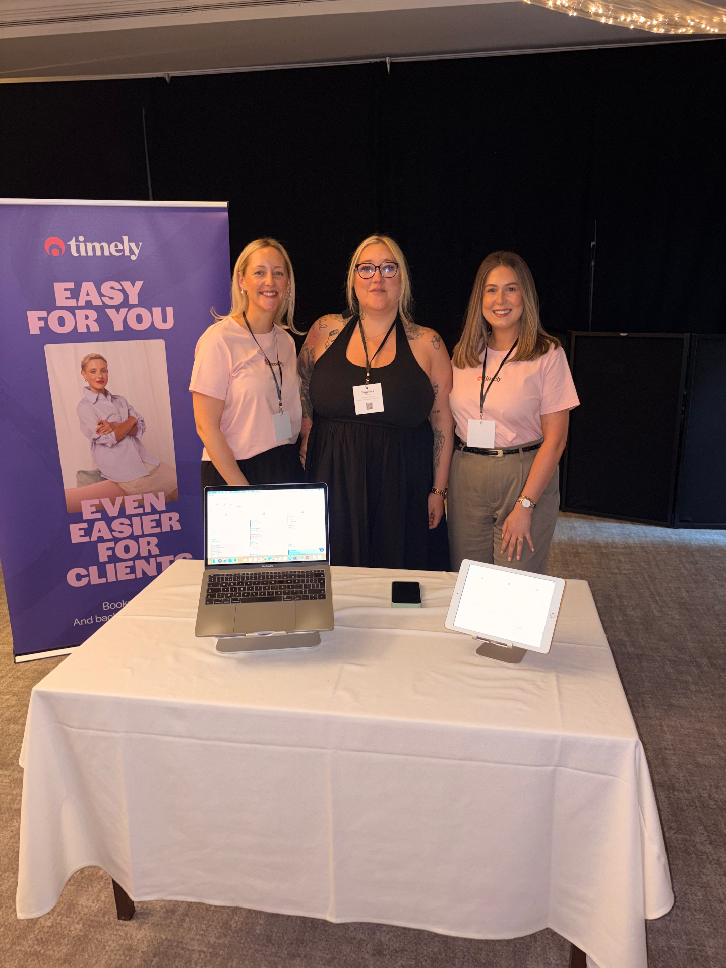 Gemma with the Timely team on the partner stand
