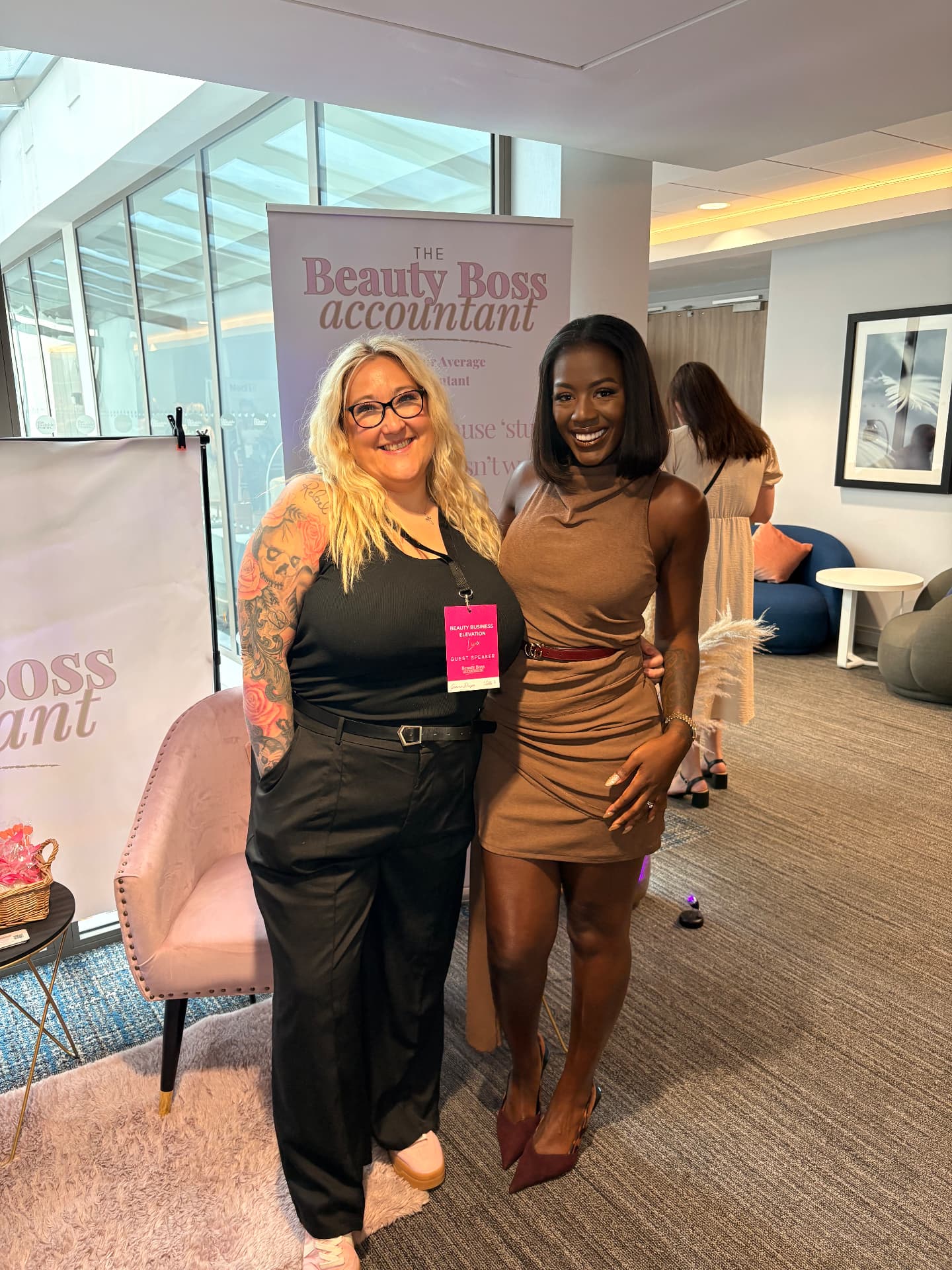 Gemma Dwyer with a guest at the Beauty Boss Accountant stand